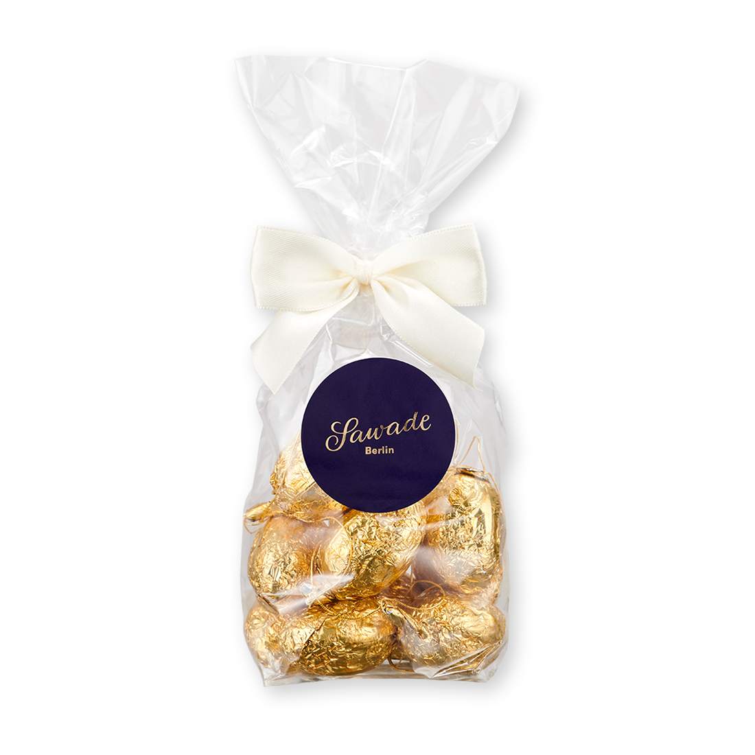 Produktbild: Nougat-Müsse in Gold stannoliert und in einem Beutel mit Schleife verpackt Produktbild: Nougat-Müsse in Gold stannoliert und in einem Beutel mit Schleife verpackt