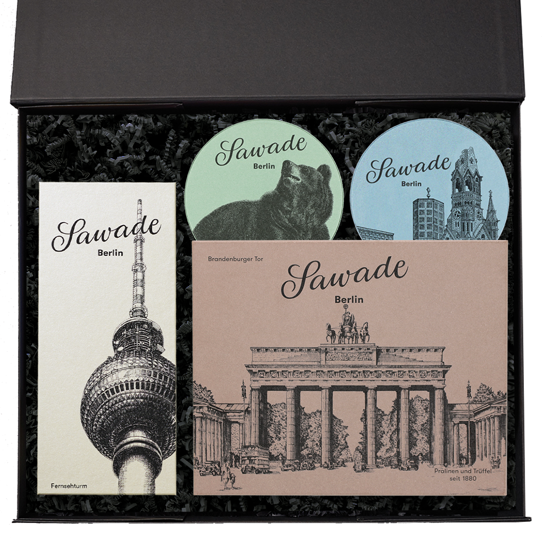 Produktbild: Geschenkeset in geöffneter Schachtel mit Pralinenschachteln und Berlin-Motven