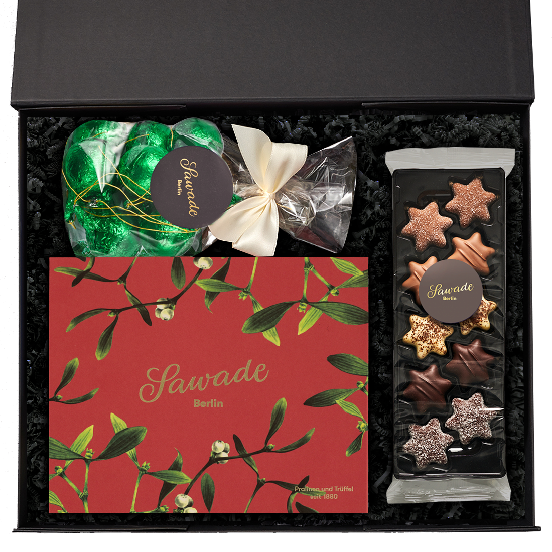 Produktbild: Geschenkeset in geöffneter Schachtel mit weihnachtlichen Spezialitäten