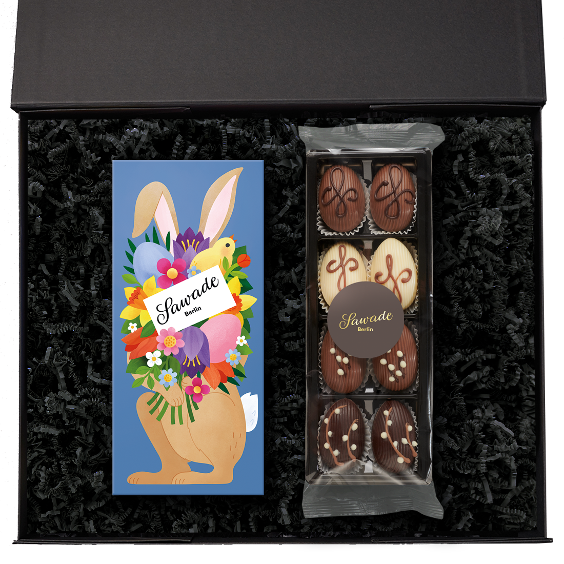 Geschenkbox »Großer Ostergruß« Geschenkbox offen mit einer Pralinenschachtel Osterhase und einer Dessert Eier Auslese