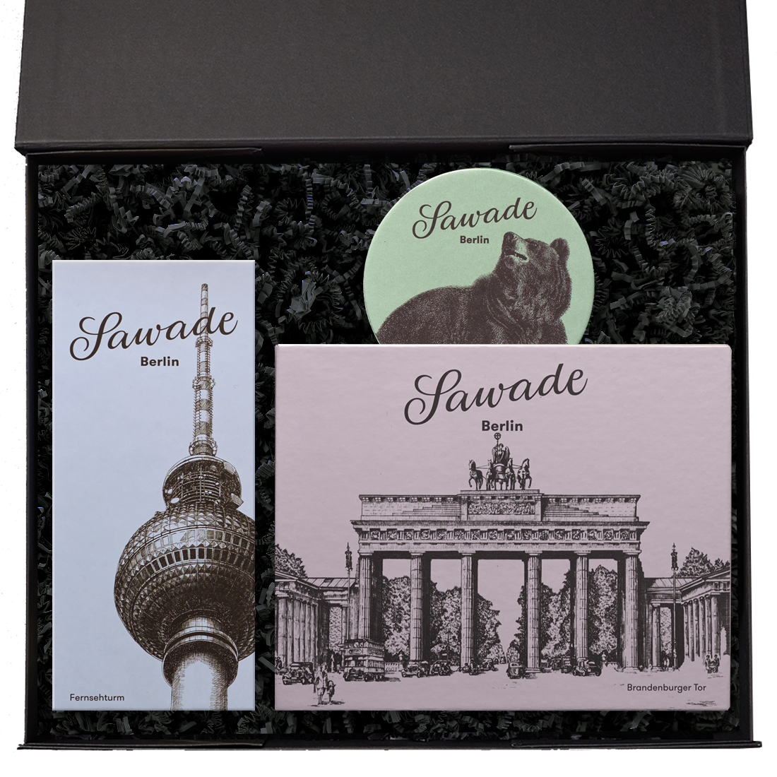 Produktbild: Geschenkeset in geöffneter Schachtel mit Pralinenschachteln und Berlin-Motven